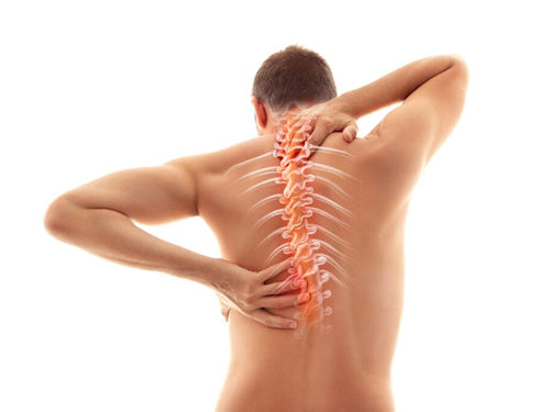 Man illustrating pain in his back