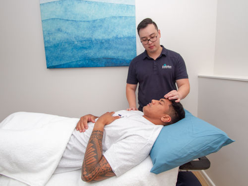 patient getting acupuncture treatment to relive pain from headaches