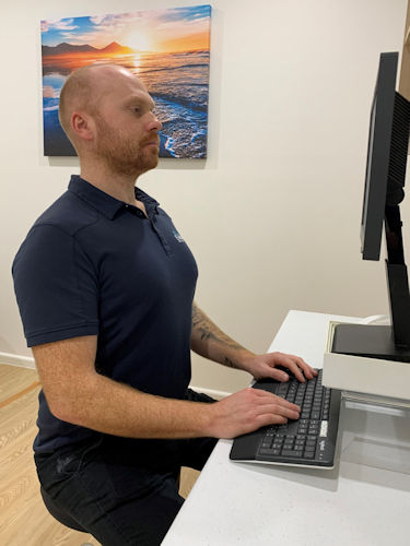 Office Worker Utilising Correct Posture