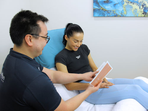 Practitioner consulting with patient about treatment for fertility