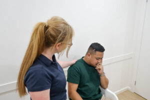 anxiety patient being comforted by practitioner when detailing their anxiety symptms and seeking natural solutions to help