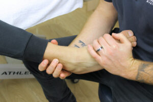 patient being assessed by practitioner for plantar fasciitis