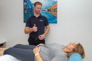 practitioner providing treatment to help patient naturally with weight loss through acupuncture treatment