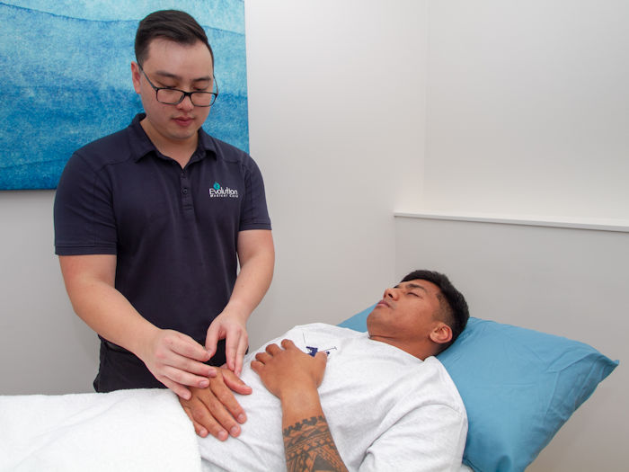 patient receiving acupuncture treatment to calm the nervous system and assist with anxiety symptoms