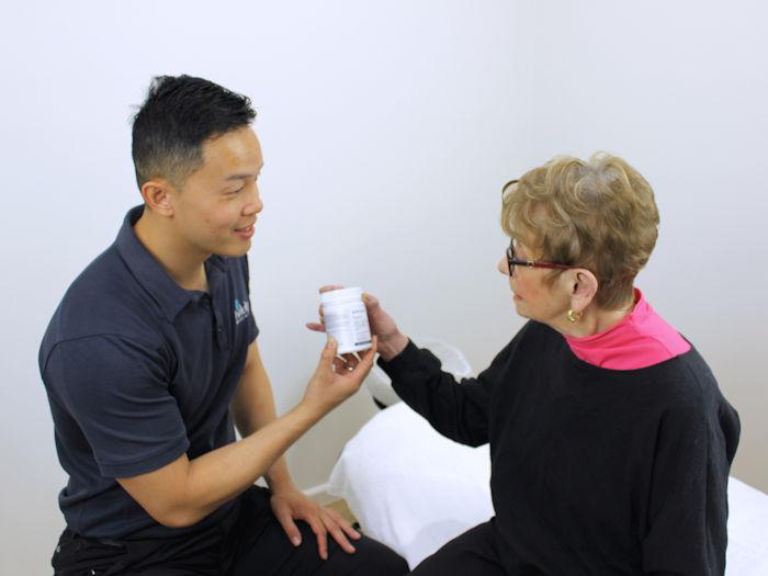 practitioner providing supplements to patient to help alleviate insomnia