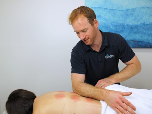 practitioner providing remedial massage therapy to help with muscular tension and depression