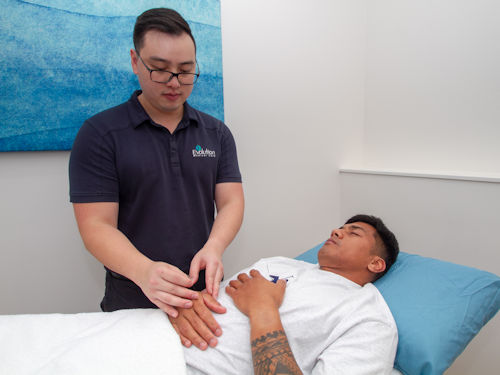patinet receiving acupuncture treatment to reduce pain and help promote a better quailty sleep