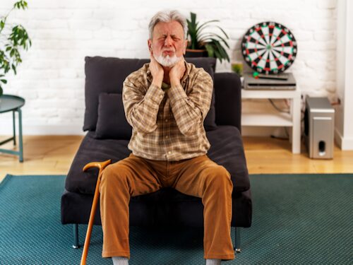 man who is a smoker experiencing chronic pain