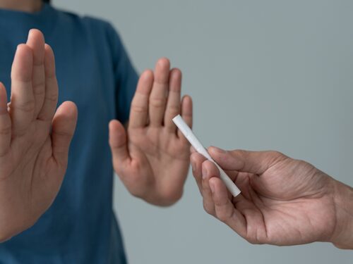 person quitting smoking to help alleviate chronic pain