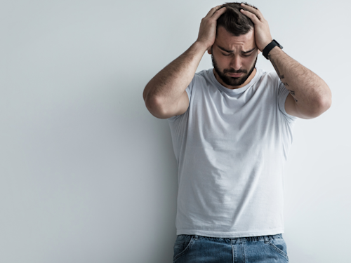 man with suffering mental health due to his chronic pain