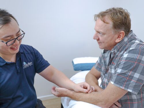 main receiving Acupuncture treatment to alleviate pain due to winter cold months
