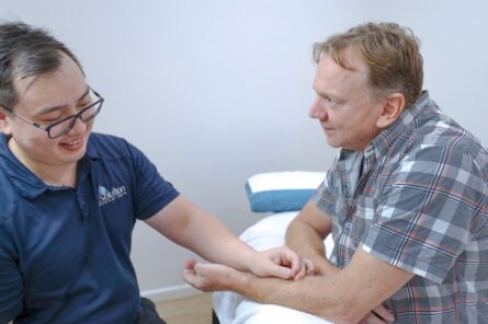 Man receiving acupuncture treatment as a ntural treatment for carpal tunnel syndrome to avoid surgery