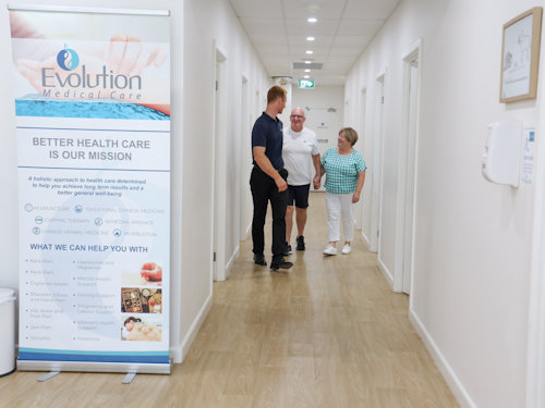 practitioner assisting patients with rheumatoid arthritis management