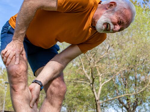 man experiencing muscle cramping due to magnesium deficiency
