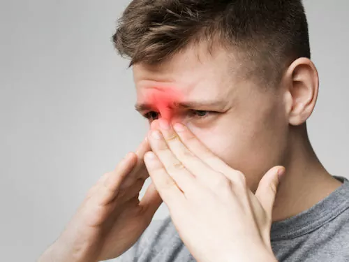 man suffering from sinusitis congestion and pain